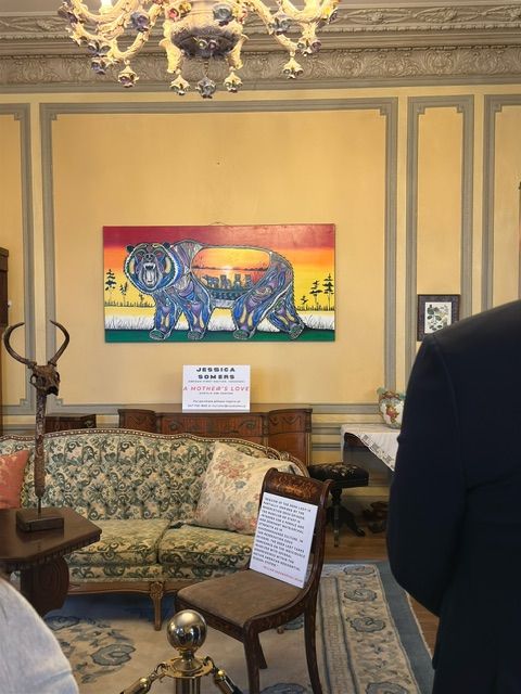 Focal Point Artistry facilitator leading a community conversation and engagement session, using Indigenous art to spark dialogue among a diverse group of participants.