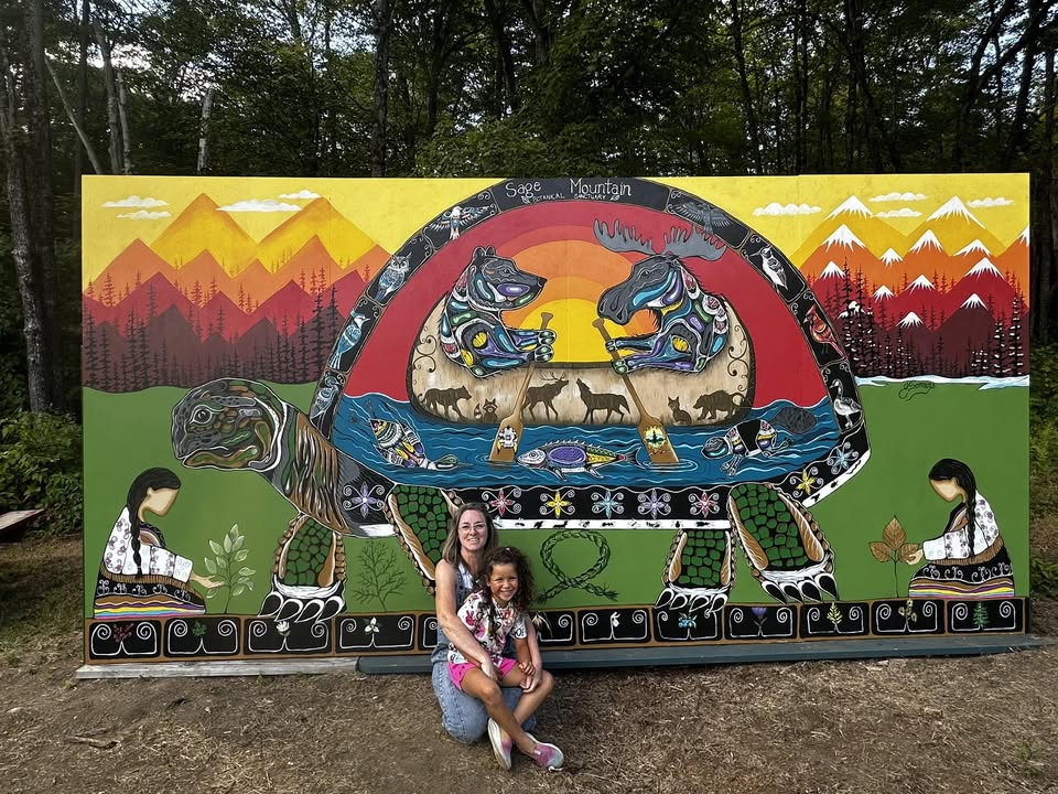 A curated exhibition of vibrant Woodland style paintings by Indigenous artist Jessica Somers, displayed in a gallery setting to showcase Wabanaki storytelling.