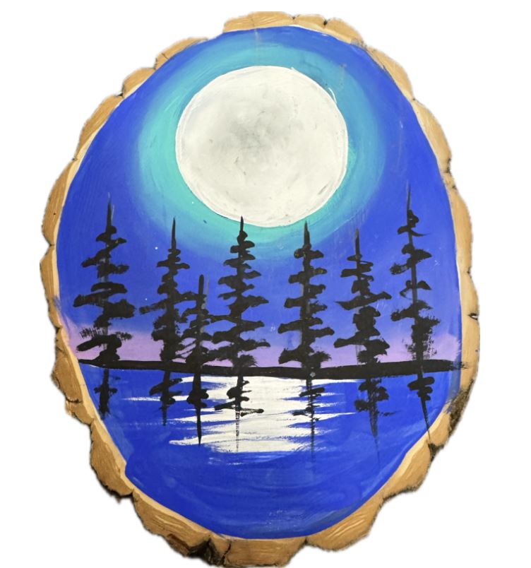 A close-up of Jessica Somers’ hands using vibrant colors and thick black lines to create Woodland style art, representing a mindful and culturally grounded creative process.